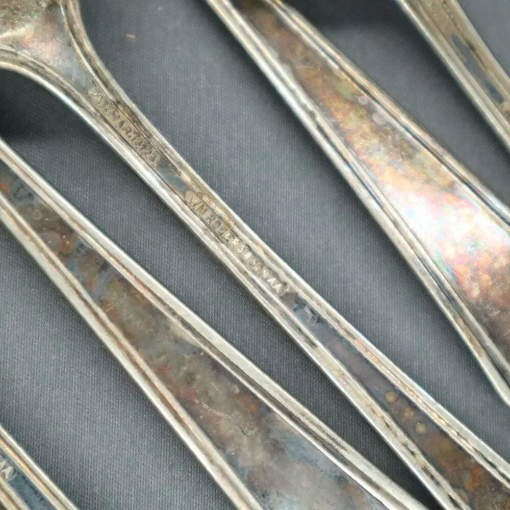 W M Rogers Flatware 12 piece set 4 spoons, 6 forks, butter knife and sugar spoon